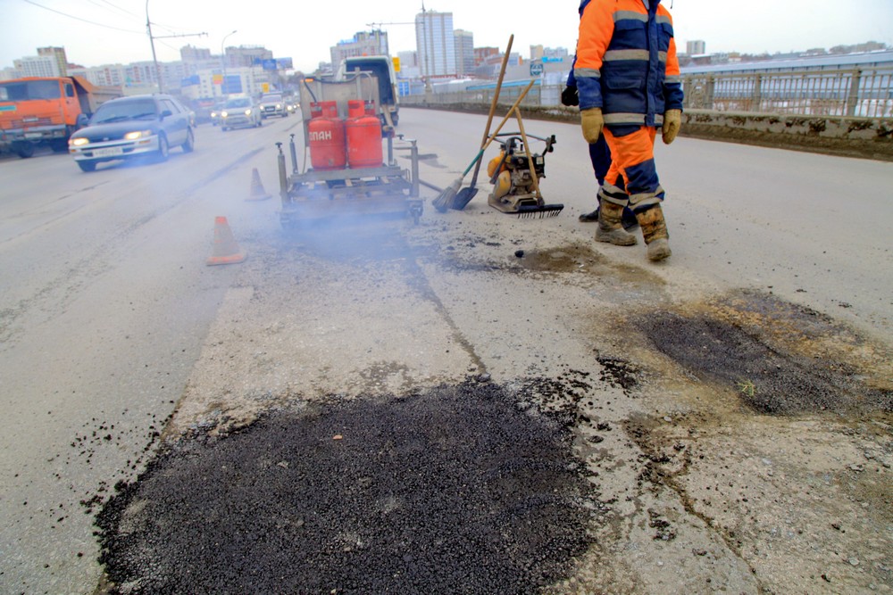 Ремонт дороги на Коммунальном мосту